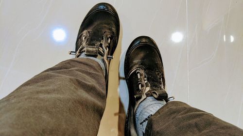 Low section of man relaxing on floor