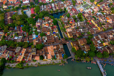 High angle view of buildings and trees in city