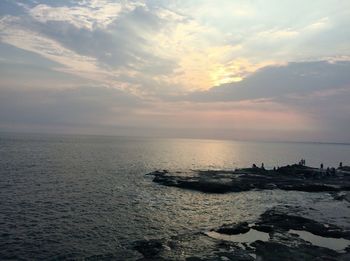 Scenic view of sea against sky at sunset