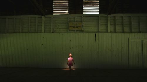 Full length of woman standing at night