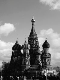 Low angle view of temple against cloudy sky