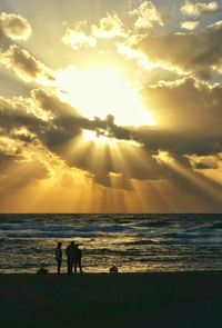 Silhouette of people on beach