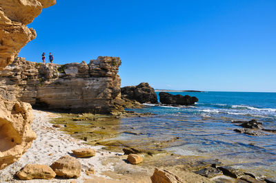 Scenic view of sea against clear blue sky