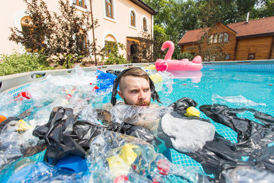 Portrait of man in swimming pool