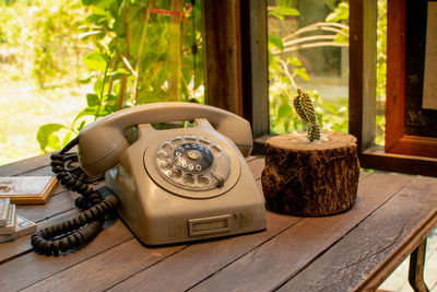 Close-up of old telephone on table