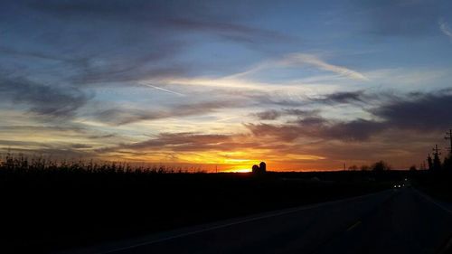 Scenic view of landscape against dramatic sky