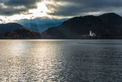 Scenic view of lake and mountains against sky