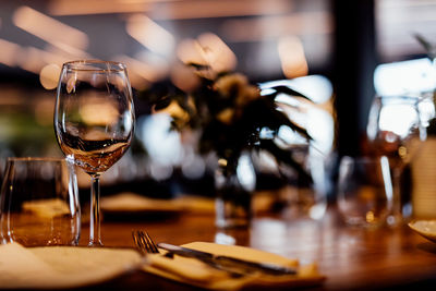 Luxury table settings for fine dining with and glassware, beautiful blurred background. 