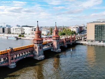 Bridge over river with buildings in background