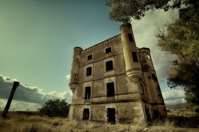 Low angle view of old building against sky