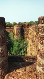 Old ruin on field against clear sky