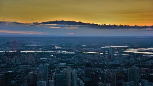 High angle view of buildings against sky at sunset