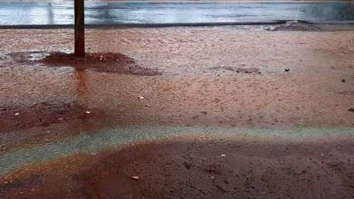 High angle view of wet puddle during rainy season