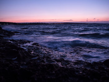 Scenic view of calm sea at dusk