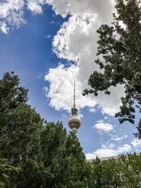 Low angle view of tower against cloudy sky
