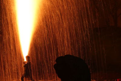 Close-up portrait of silhouette man standing against sky during sunset