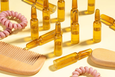 Group, set cosmetic ampoules with serum for hair growth, restoration. hard shadow. close up