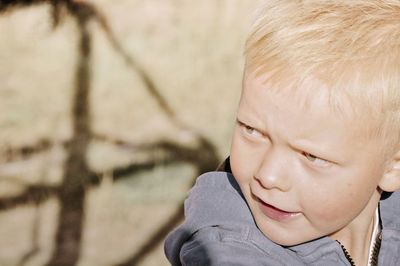 Close-up portrait of boy looking away