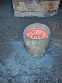 High angle view of tea light candles on metal