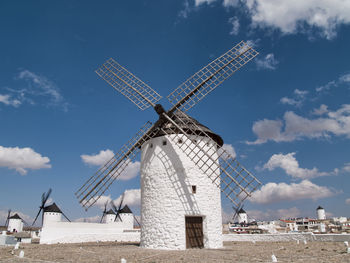 Traditional windmill against sky