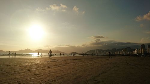 Scenic view of beach against sky during sunset