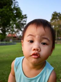 Portrait of cute baby girl in park