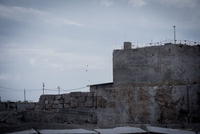 Building against sky during winter