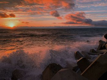 Scenic view of sea against sky during sunset