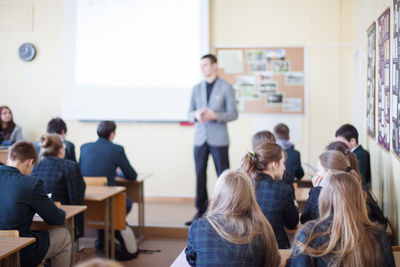 Group of people sitting in classroom