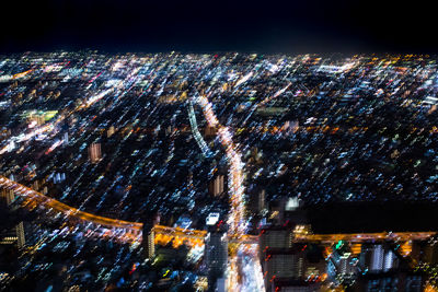 Low angle view of illuminated cityscape against sky