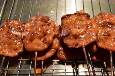 High angle view of meat on barbecue grill