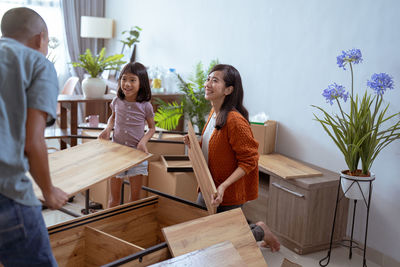 Portrait of smiling friends working at home