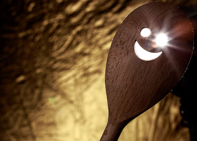 Close-up of light streaming through wooden spatula