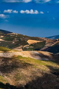 Scenic view of landscape against blue sky