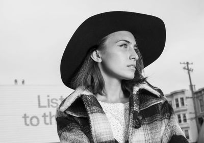 Portrait of a young woman looking away