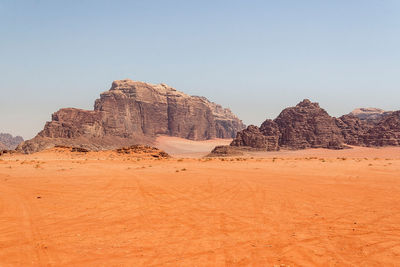 Rock formations in desert against clear sky