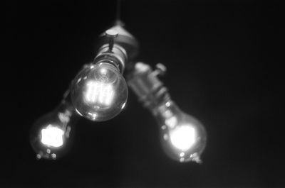 Low angle view of illuminated light bulb