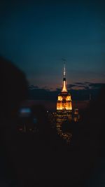 Illuminated buildings in city at night