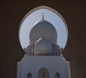 High section of domed structure against clear sky