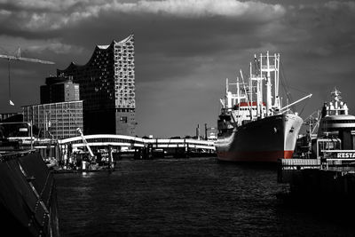 Boats in sea with city in background