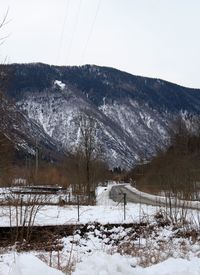 Scenic view of mountains against clear sky during winter