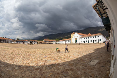 People on beach against sky