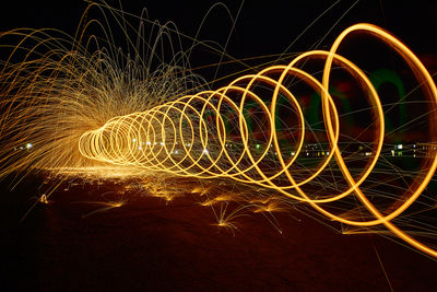 Low angle view of light trails at night