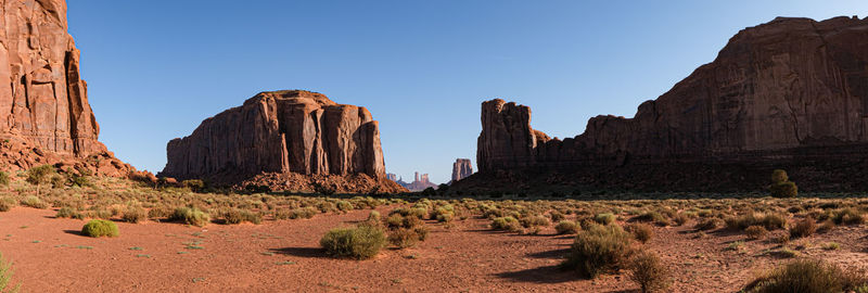 Rock formations on landscape against sky