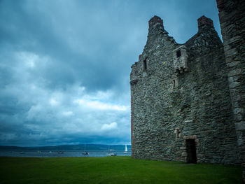 Castle against cloudy sky