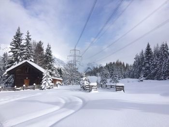 Ski lift against sky during winter