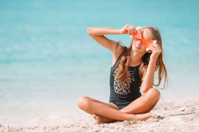 Woman sitting on beach