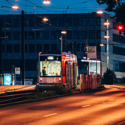 View of illuminated street lights at night