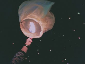 Close-up of hand holding illuminated lights