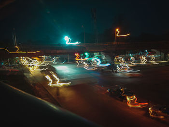 Illuminated light trails in city at night